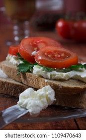 Sandwich toast bread for breakfast with cheese and orange juice, tomatoes, lettuce