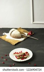sandwich with cheese, greens and pomegranate berries 