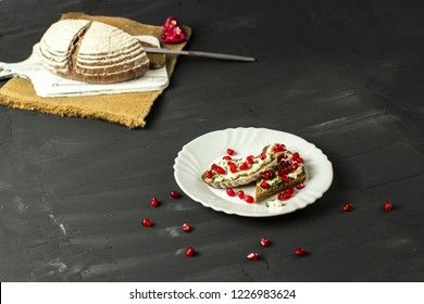 sandwich with cheese, greens and pomegranate berries 