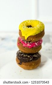 donuts stacked on a white background