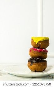 donuts stacked on a white background