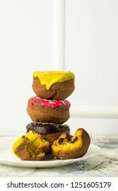 donuts stacked on a white background