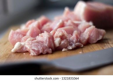 Slices of pork on a cutting board