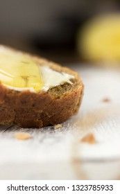 Pieces of bread with butter and honey, macro