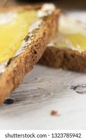 Pieces of bread with butter and honey, macro