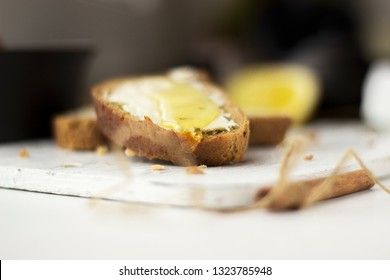 Pieces of bread with butter and honey, macro