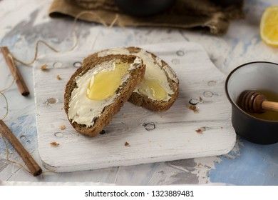 Pieces of bread with butter and honey