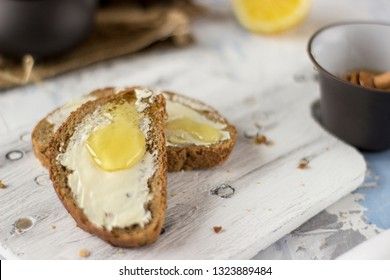 Pieces of bread with butter and honey