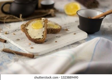Pieces of bread with butter and honey