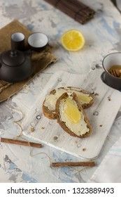 Pieces of bread with butter and honey
