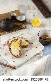 Pieces of bread with butter and honey