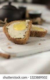 Pieces of bread with butter and honey
