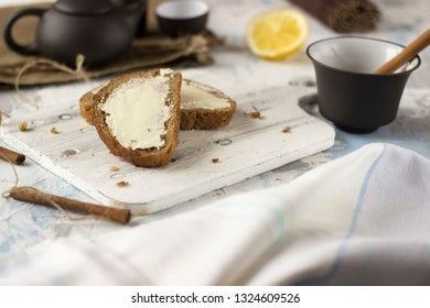 Pieces of bread with butter and honey