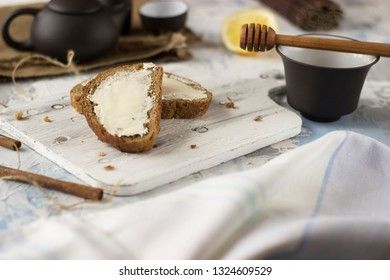 Pieces of bread with butter and honey