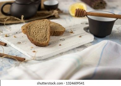 Pieces of bread with butter and honey