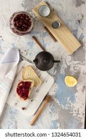 Bread with homemade cherry jam on a light background, top view