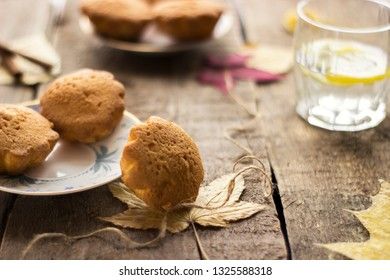 Sweet cupcakes on old wooden background.