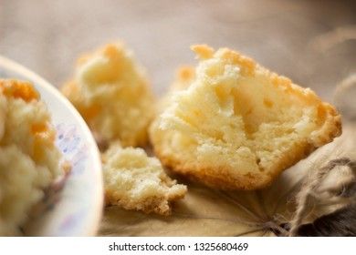 Sweet cupcakes on old wooden background. Macro.