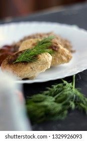 Chicken cutlets with buckwheat, herbs, ketchup and tomatoes