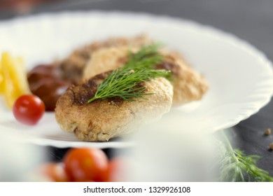 Chicken cutlets with buckwheat, herbs, ketchup and tomatoes