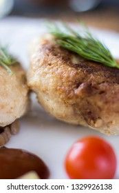 Chicken cutlets with buckwheat, herbs, ketchup and tomatoes