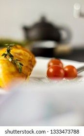 Baked chicken breast with onions and tomatoes on a white plate. Healthy food.
