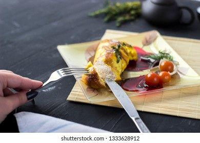 Baked chicken breast with onions and tomatoes on a white plate. Healthy food.