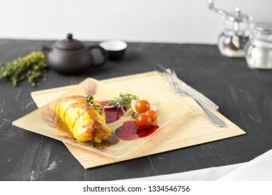 Baked chicken breast with onions and tomatoes on a white plate. Healthy food.