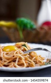 Delicious pasta with egg yolk, on wooden table.
