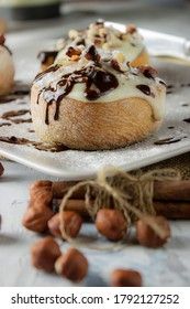 original cinnabon rolls with chocolate-cream sauce and hazelnuts