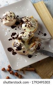 original cinnabon rolls with chocolate-cream sauce and hazelnuts