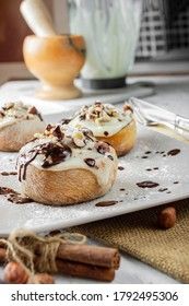 original cinnabon rolls with chocolate-cream sauce and hazelnuts