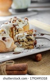 original cinnabon rolls with chocolate-cream sauce and hazelnuts