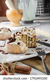 original cinnabon rolls with chocolate-cream sauce and hazelnuts