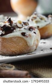original cinnabon rolls with chocolate-cream sauce and hazelnuts