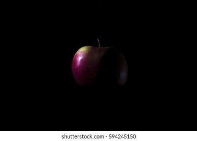 apple on a black background