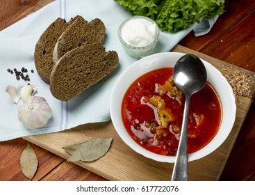 ukrainian, russian beetroot soup borscht on napkin on wooden background 