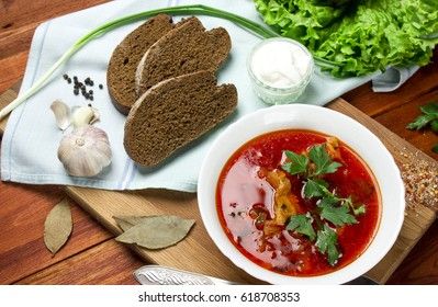 ukrainian, russian beetroot soup borscht on napkin on wooden background