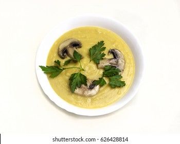 Cream pea soup with mushrooms, greens and breadcrumbs