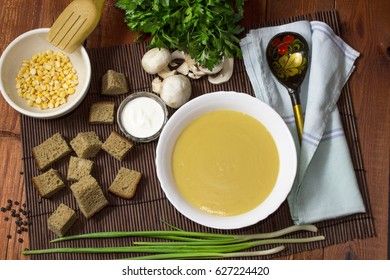 Cream pea soup with mushrooms, greens and breadcrumbs