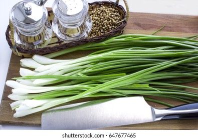 Fresh green onion on a cutting board