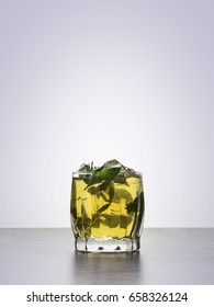 Apple juice with mint and ice in a glass