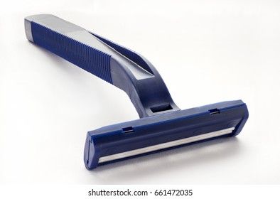 Disposable blue shaving machine on a white background in a macro
