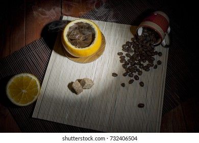 Fragrant coffee made in an orange in a low key